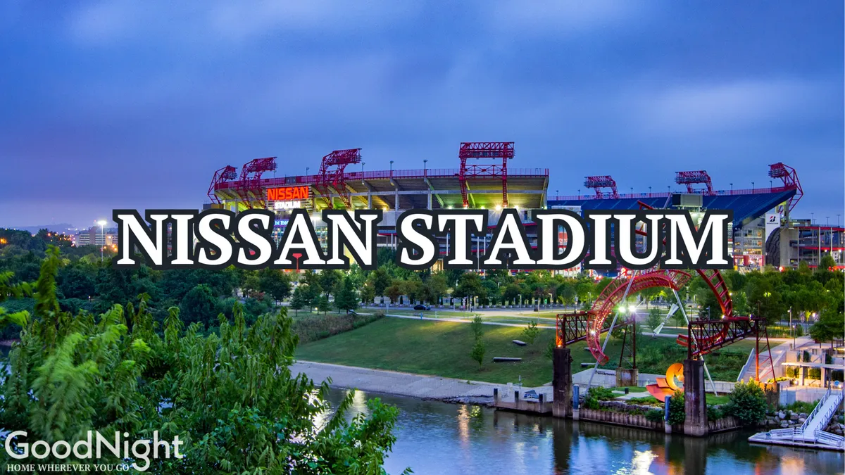 A sweeping exterior view of Nissan Stadium, featuring the stadium itself, the adjacent river, green park areas, and a bridge. The lively composition highlights the stadium’s role as a destination for large-scale sports and community events.